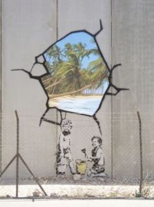 A Banksy trompe-l'oeil painting on a security fence in the West Bank.